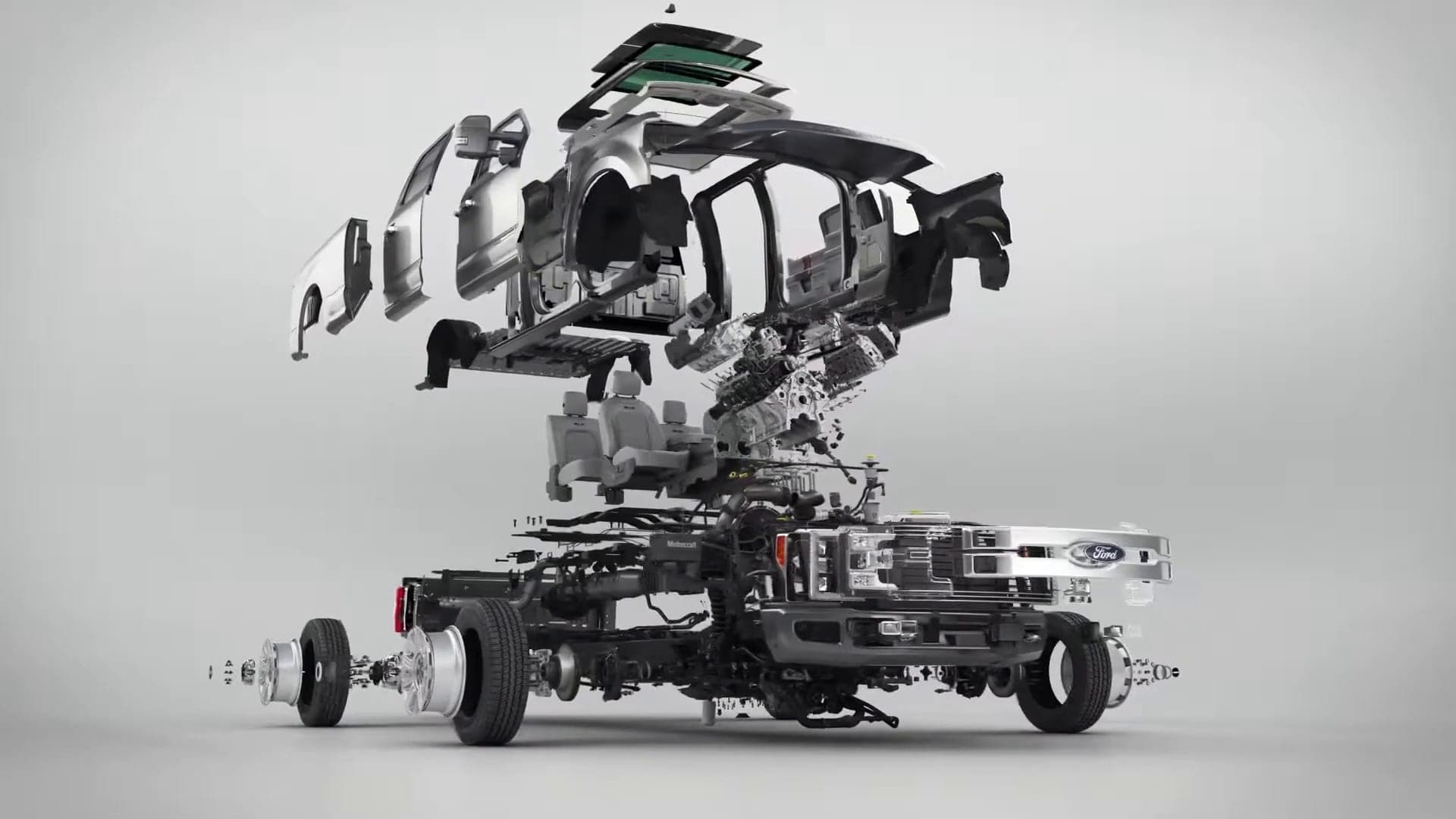 Exploded view of a pickup truck with body panels, chassis and components separated in mid-air