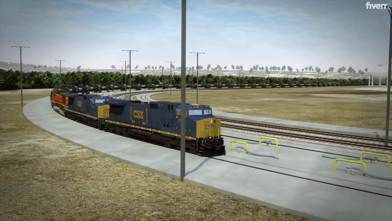 Locomotives pulling a unit train of tank cars into a rail yard